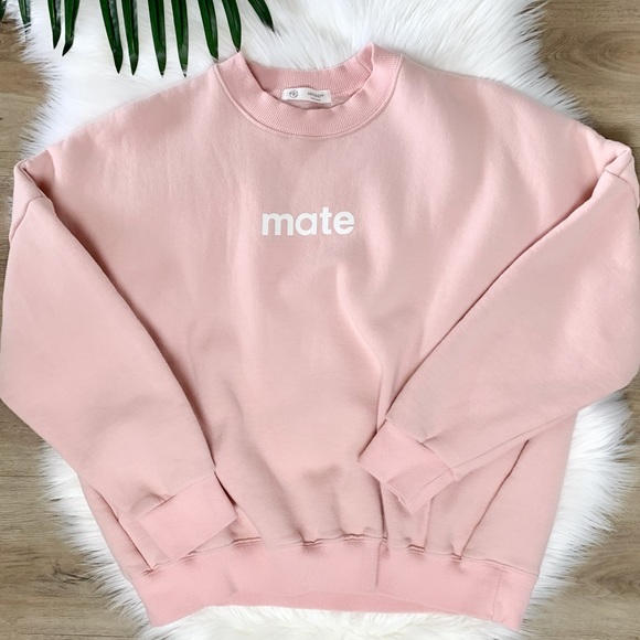 Sweaters - Mate graphic light pink fuzzy sweatshirt pockets